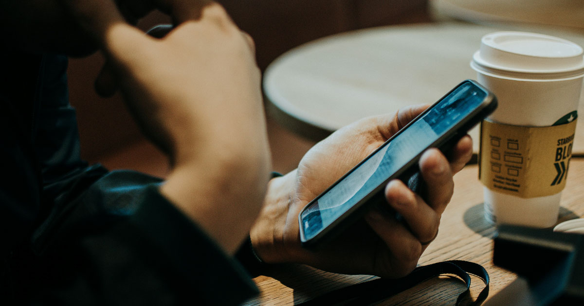 Person Holding Mobile Phone